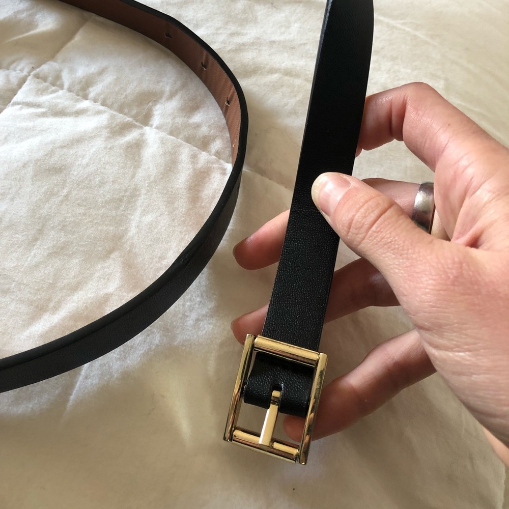 Reversible black/brown thin belt. Size small.